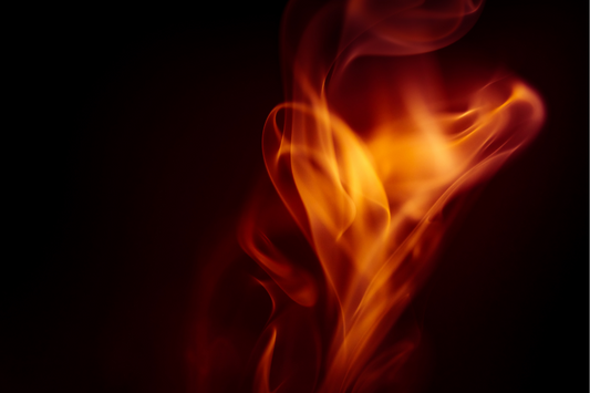Sacred flame rising in darkness, symbolizing Norse fire rituals for energy clearing, purification, and transformation.
